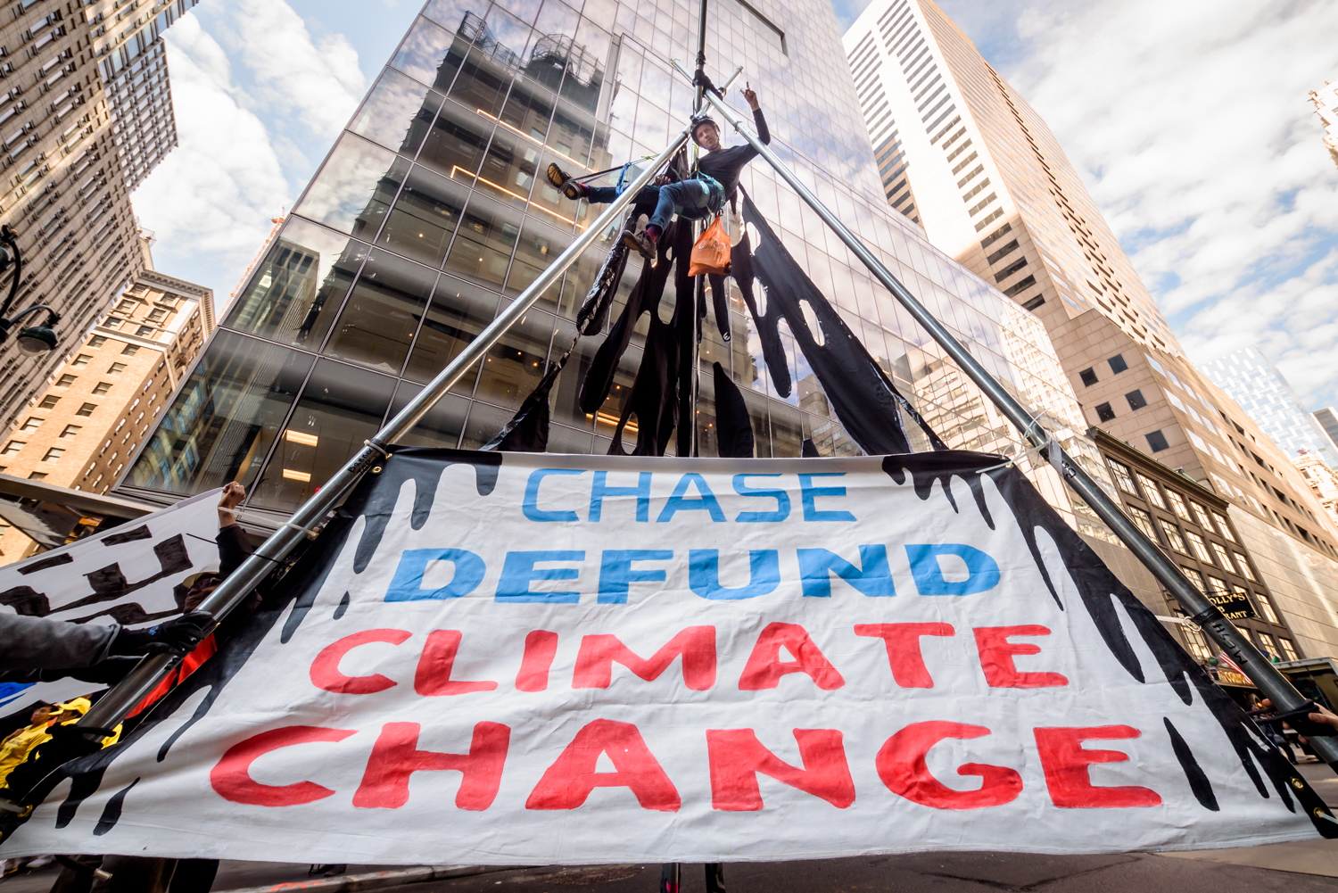 banner hangs from metal poles