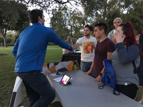 Cal Poly San Luis Obispo students engage with a Pepsi recruiter on campus.]