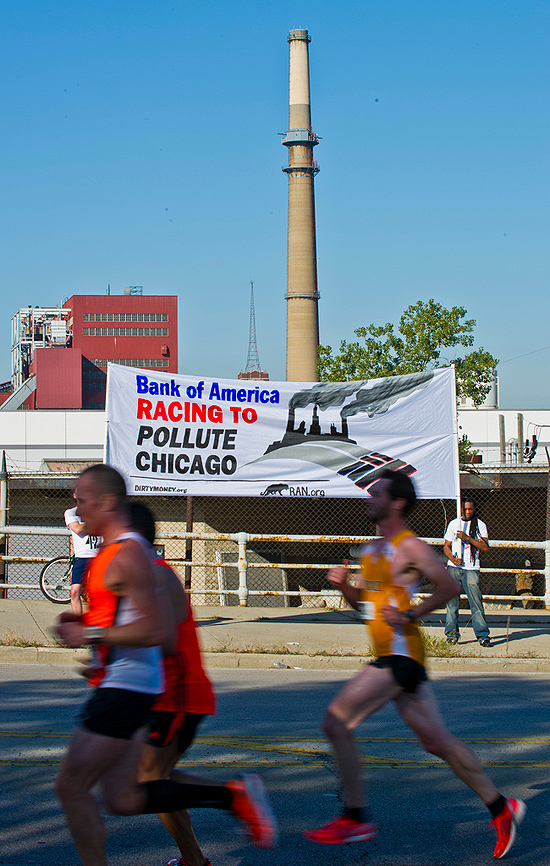 RAN activists hold up banner outside Fisk coal-fired power plant during Chicago Marathon