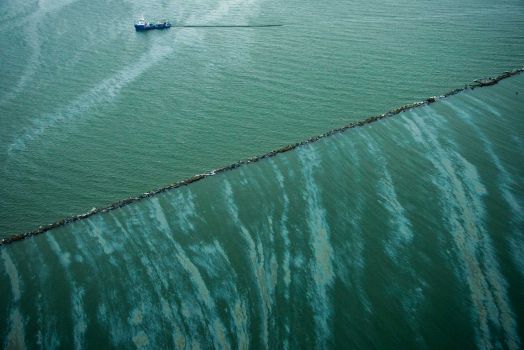 Booms attempt to contain the Galveston Bay oil spill. Photo Credit: Smiley N. Pool/AP