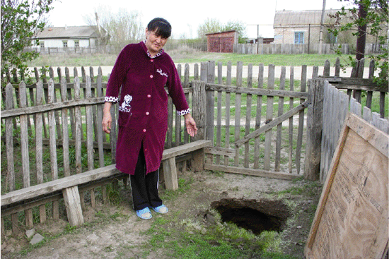 Sinkhole in yard of Saniya Nurzhanova, the village Berezovka, April 2012.
