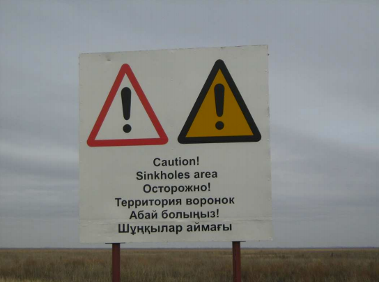 One of three signs posted by Karachaganak Petroleum Operating about the danger of sink holes, near the village of Zhanatalap, January 2011.
