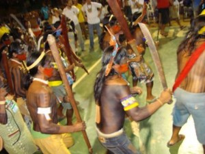 Kayapo men enter gymnasium at opening ceremony